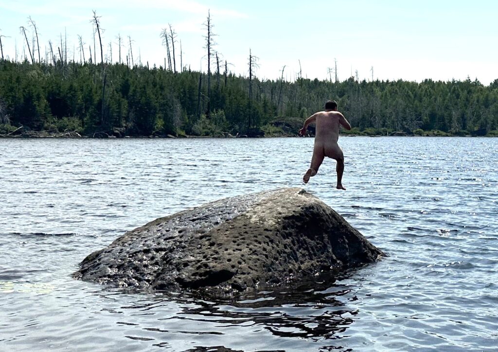 Person jumping nude into a lake in Minnesota